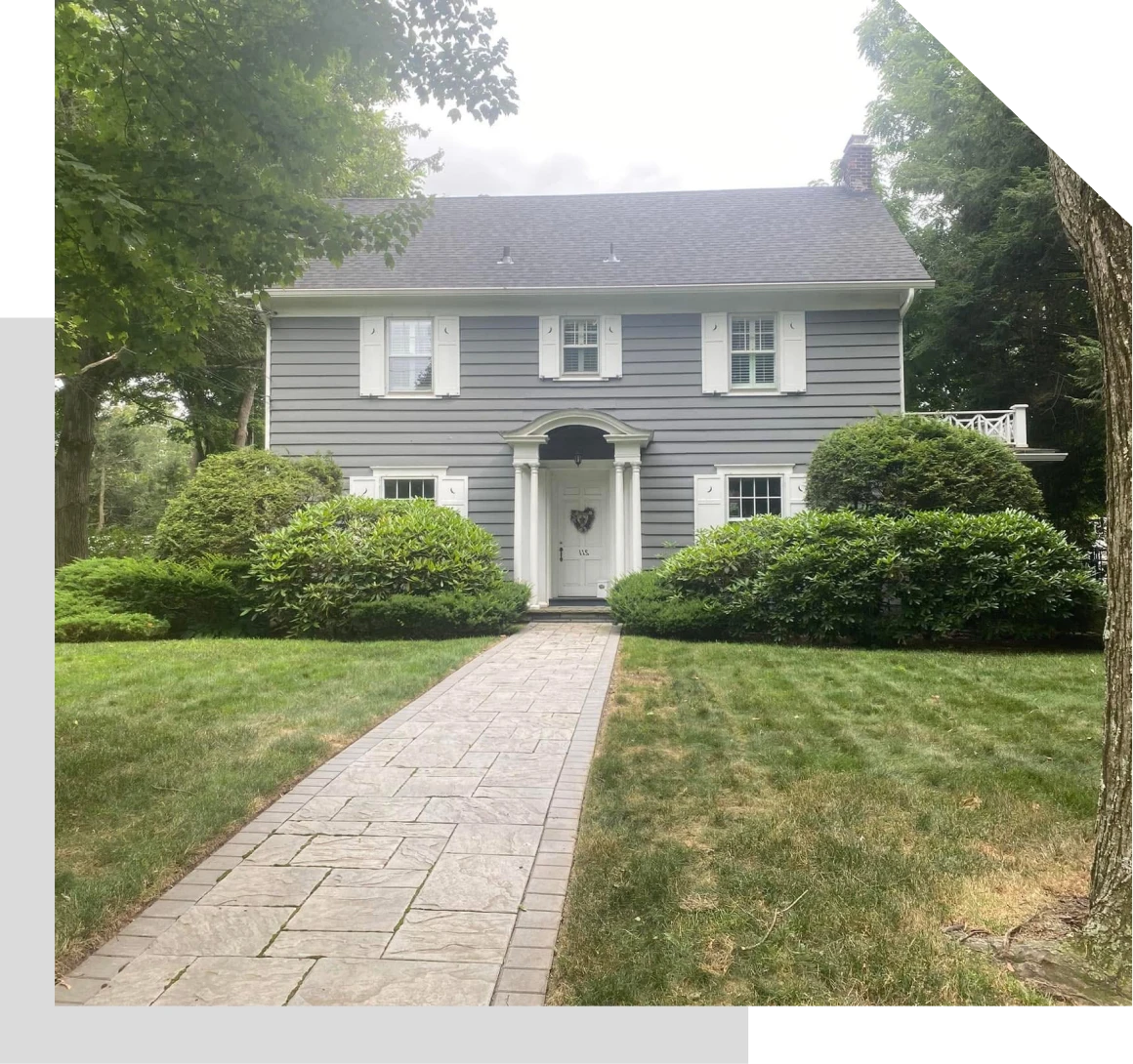 Traditional two-story home with green lawn