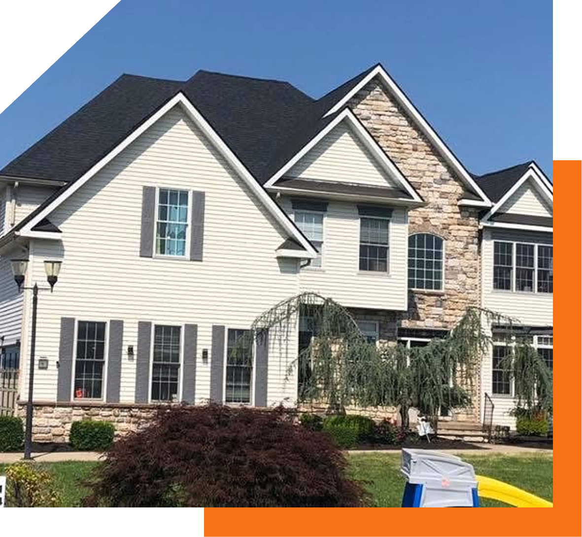 Suburban house with landscaped front yard.