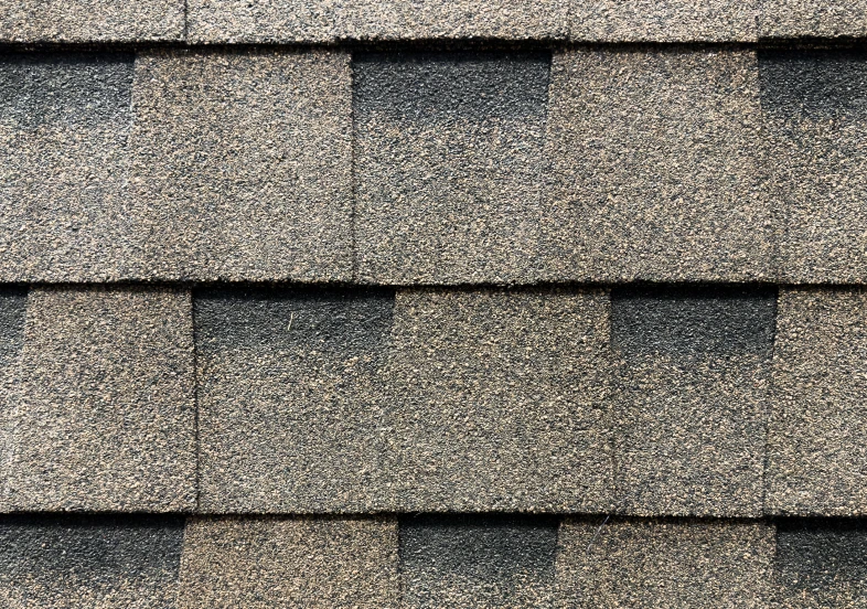 Textured roofing shingles in gray and black
